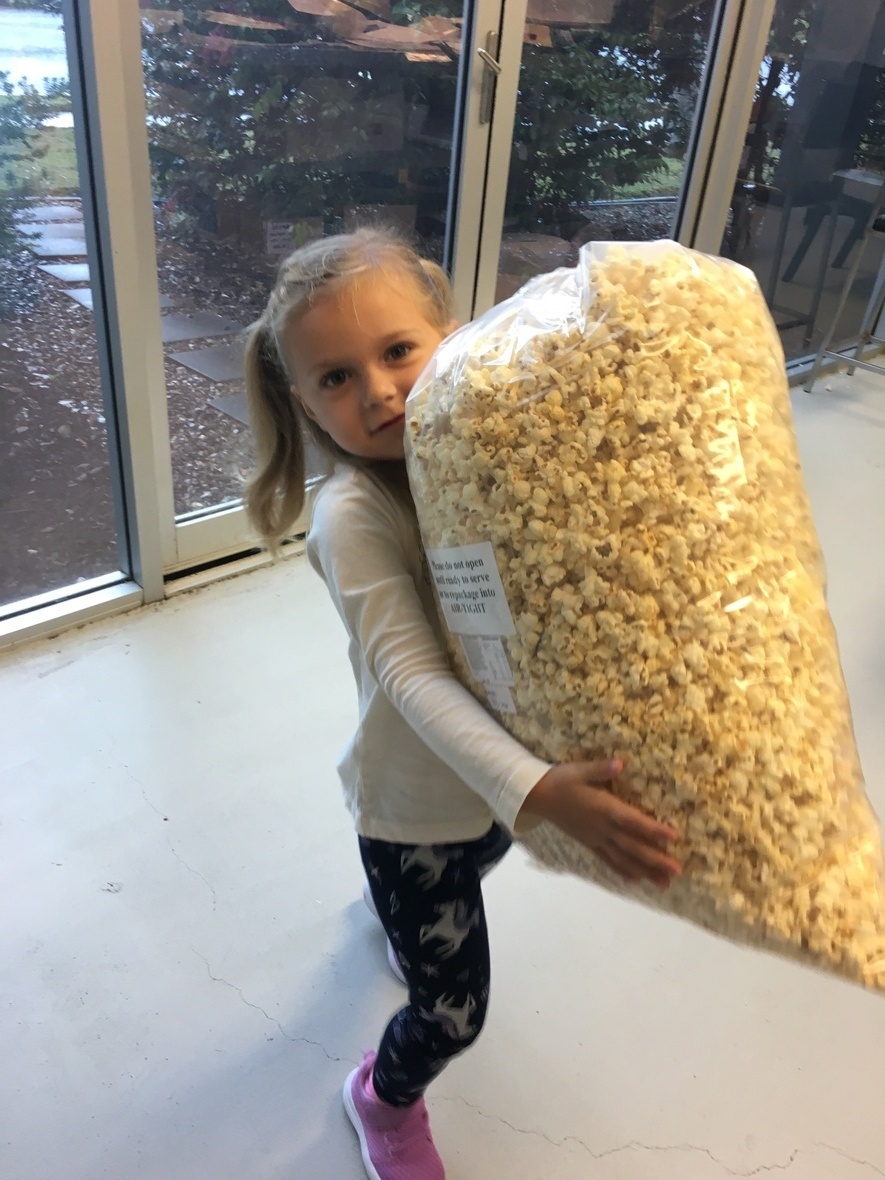 child with monster bag popcorn